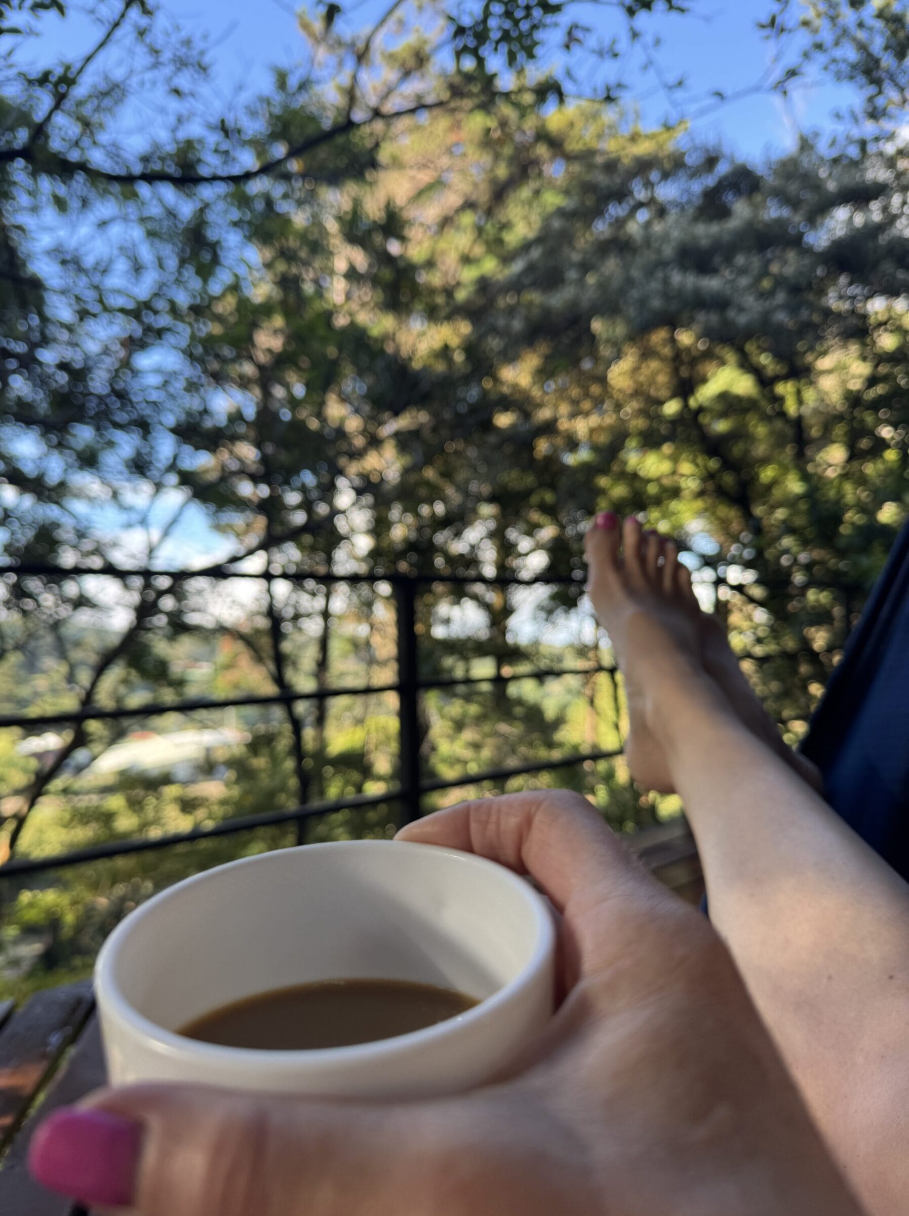 Feet and coffee from a hammock view at Los Pinos in Monteverde Costa Rica