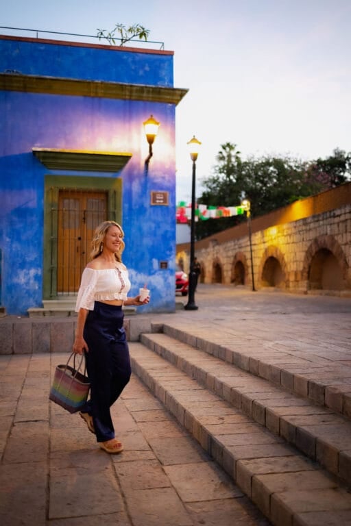 Otehlia near a blue wall in Oaxaca City