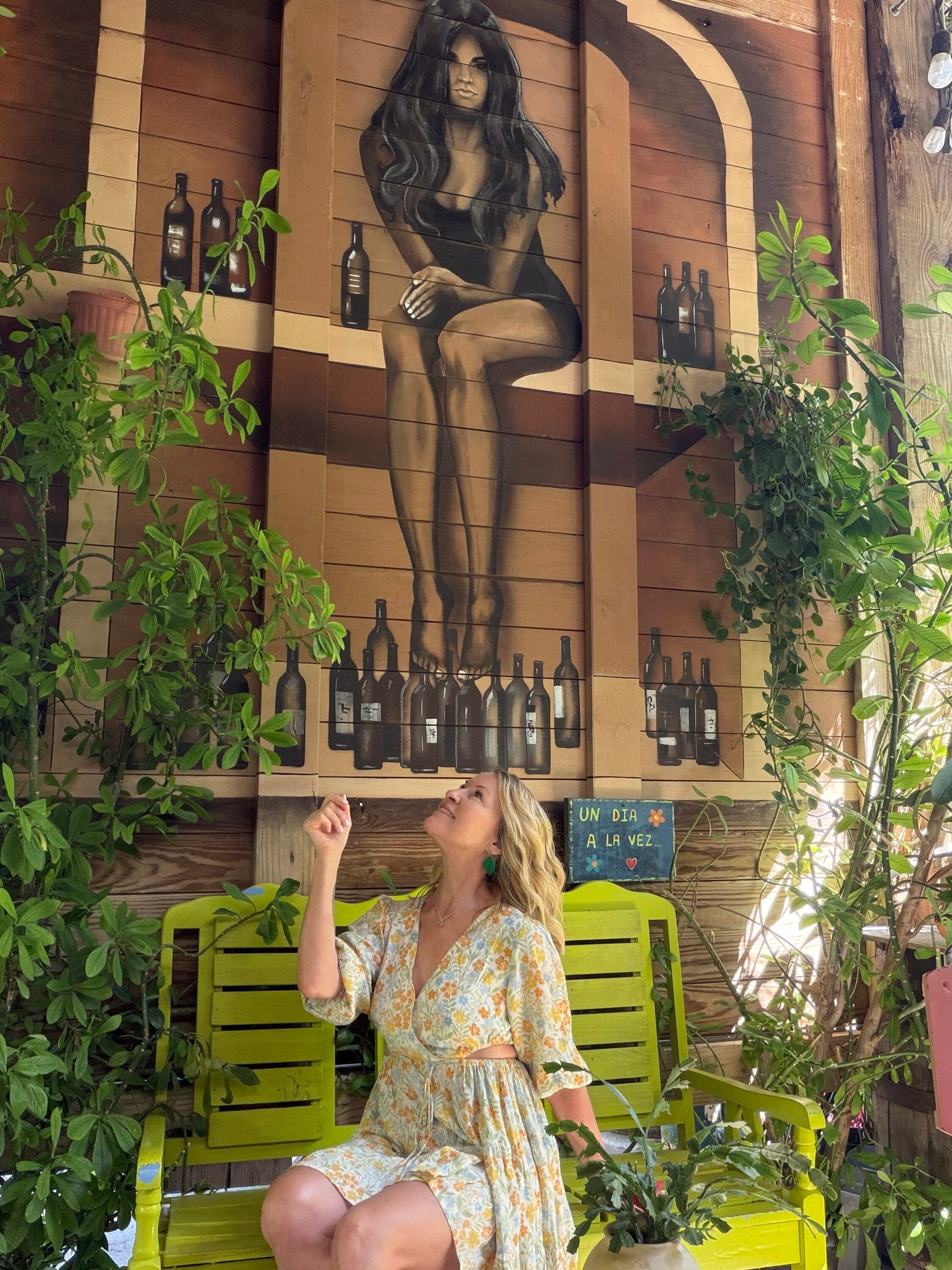 Woman sitting in Bar El refugio