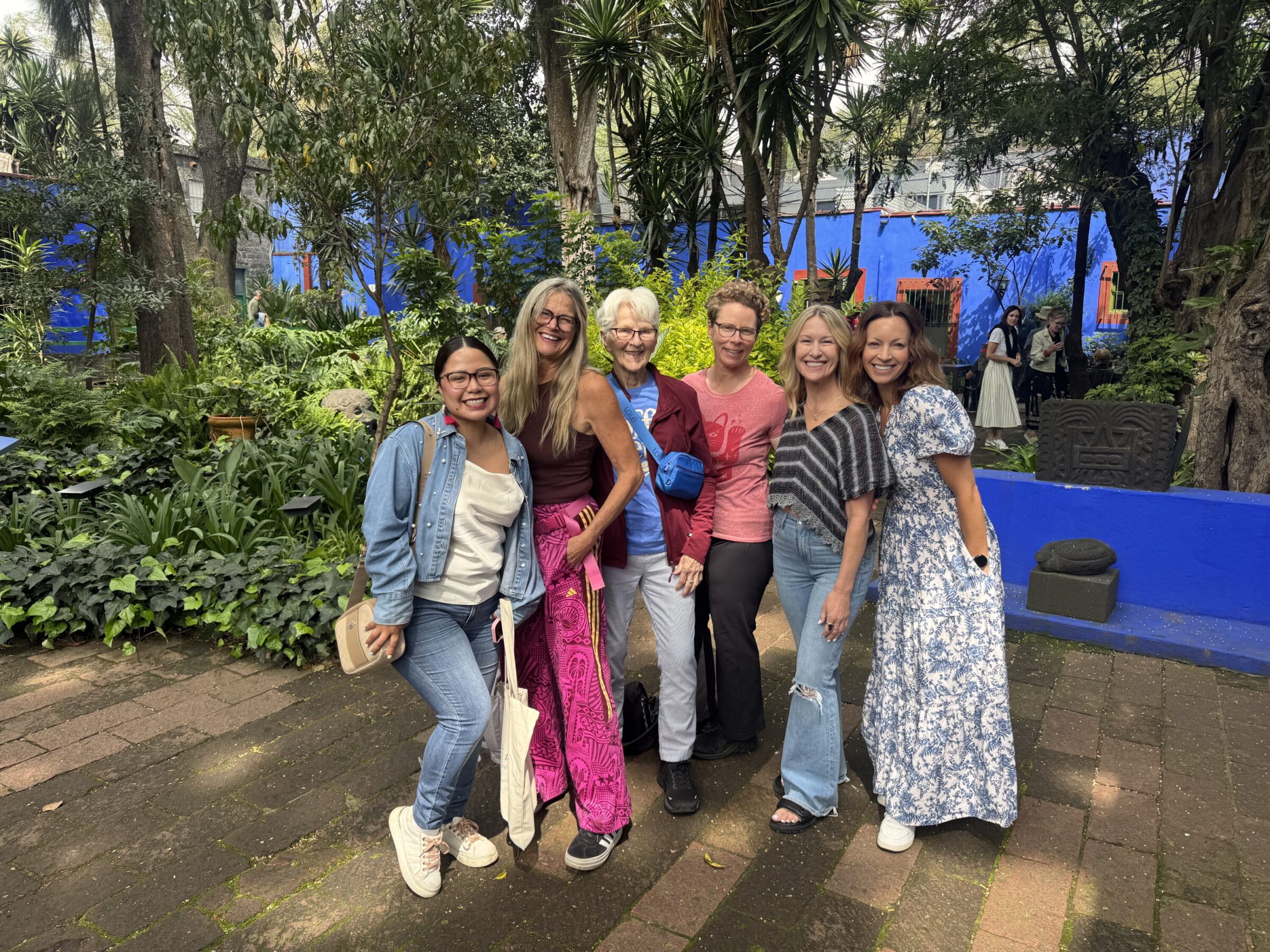 Group with local guide in courtyard of Frida Khalo house